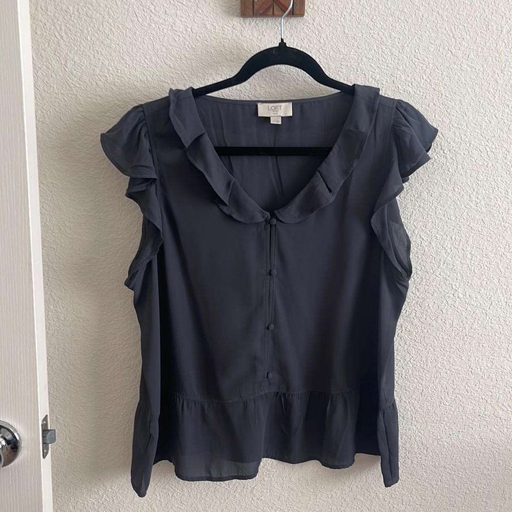 NWOT. Dark gray short sleeve blouse with flowy ruffles. Great for work!